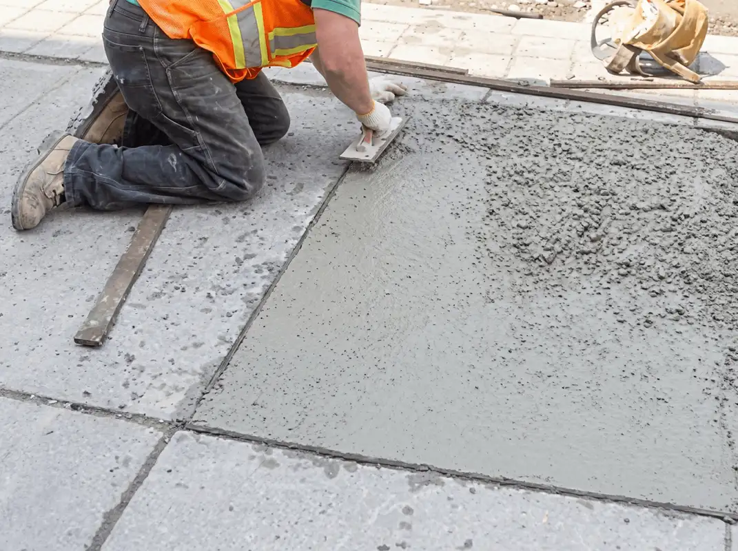 Professional repairing a concrete floor in Mesa, AZ